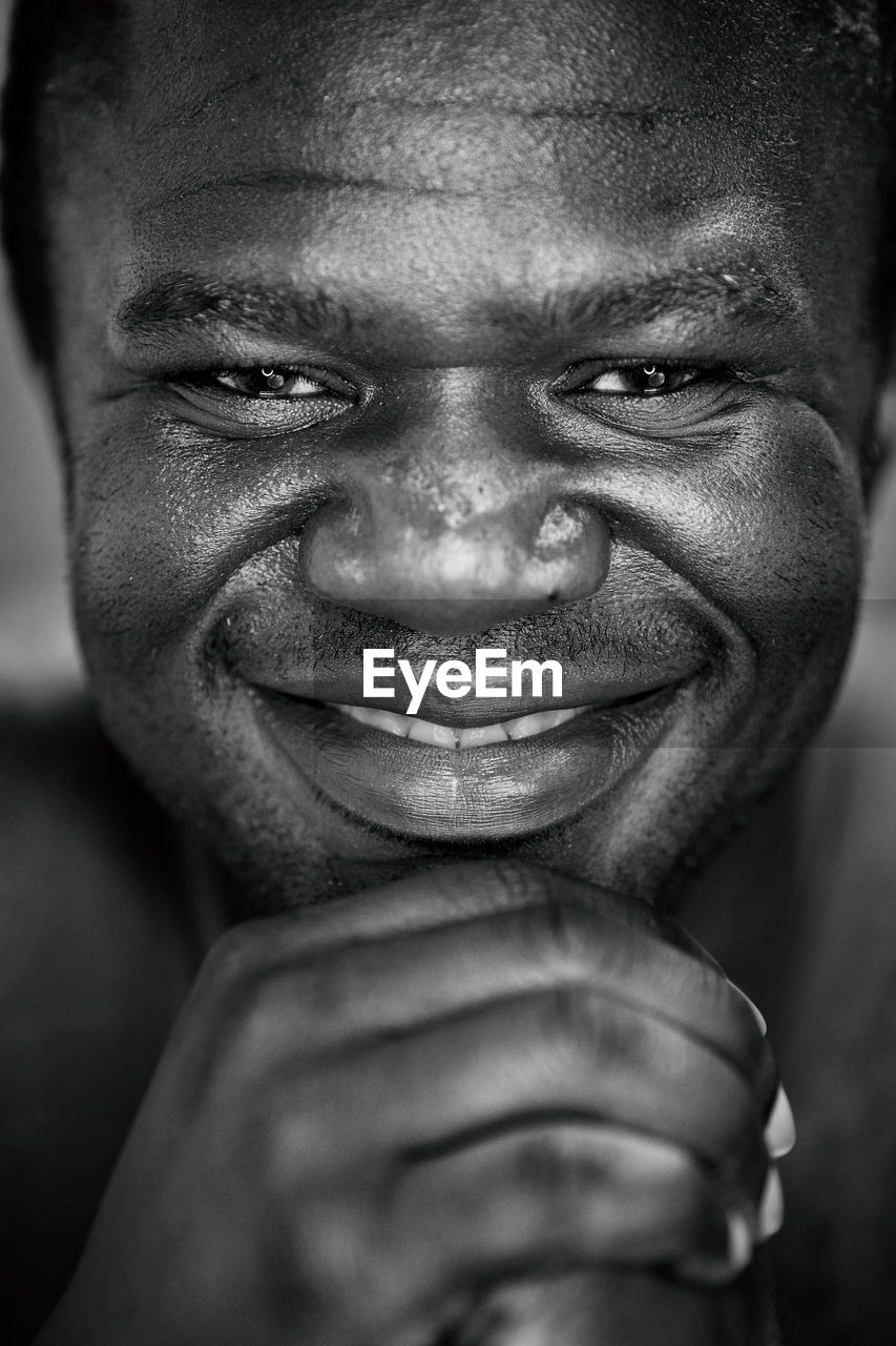 Close-up portrait of smiling mid adult man