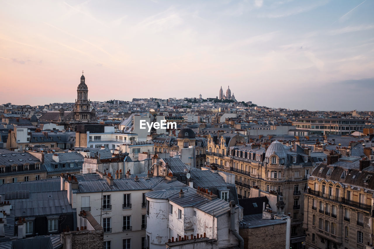 High angle view of city at sunset