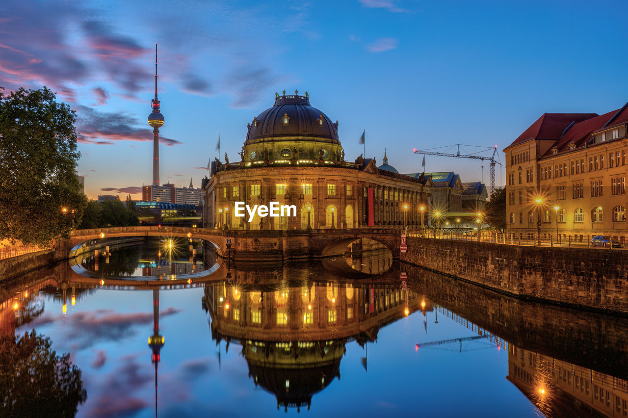 The river spree in berlin at blue hour with the famous tv tower and the museum island