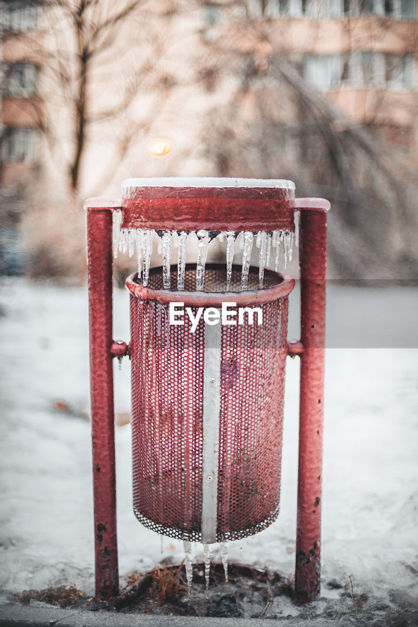 High angle view of frozen garbage bin