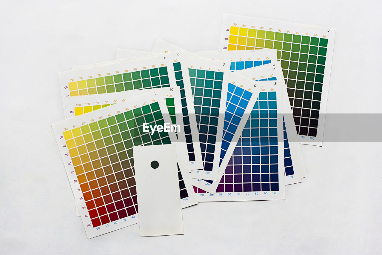 High angle view of color swatches over white background