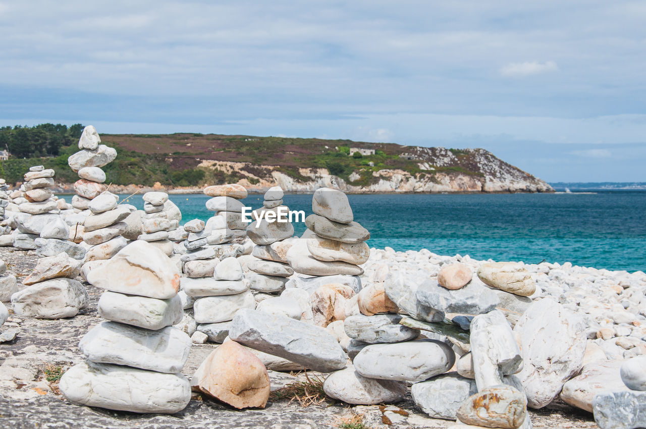 STACK OF ROCKS ON SHORE