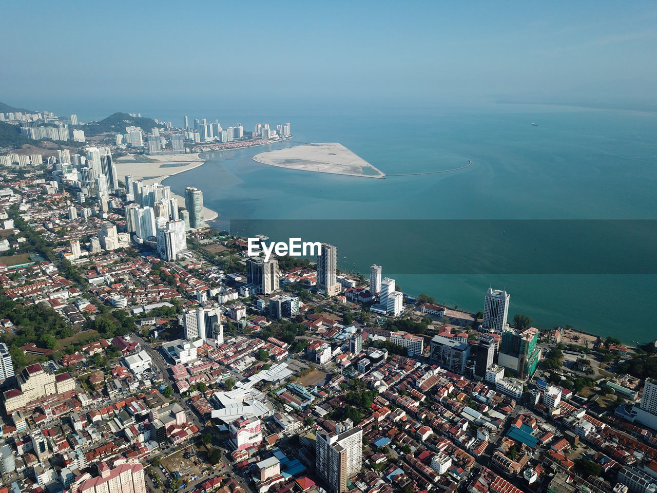 HIGH ANGLE VIEW OF BUILDINGS IN CITY AGAINST SKY