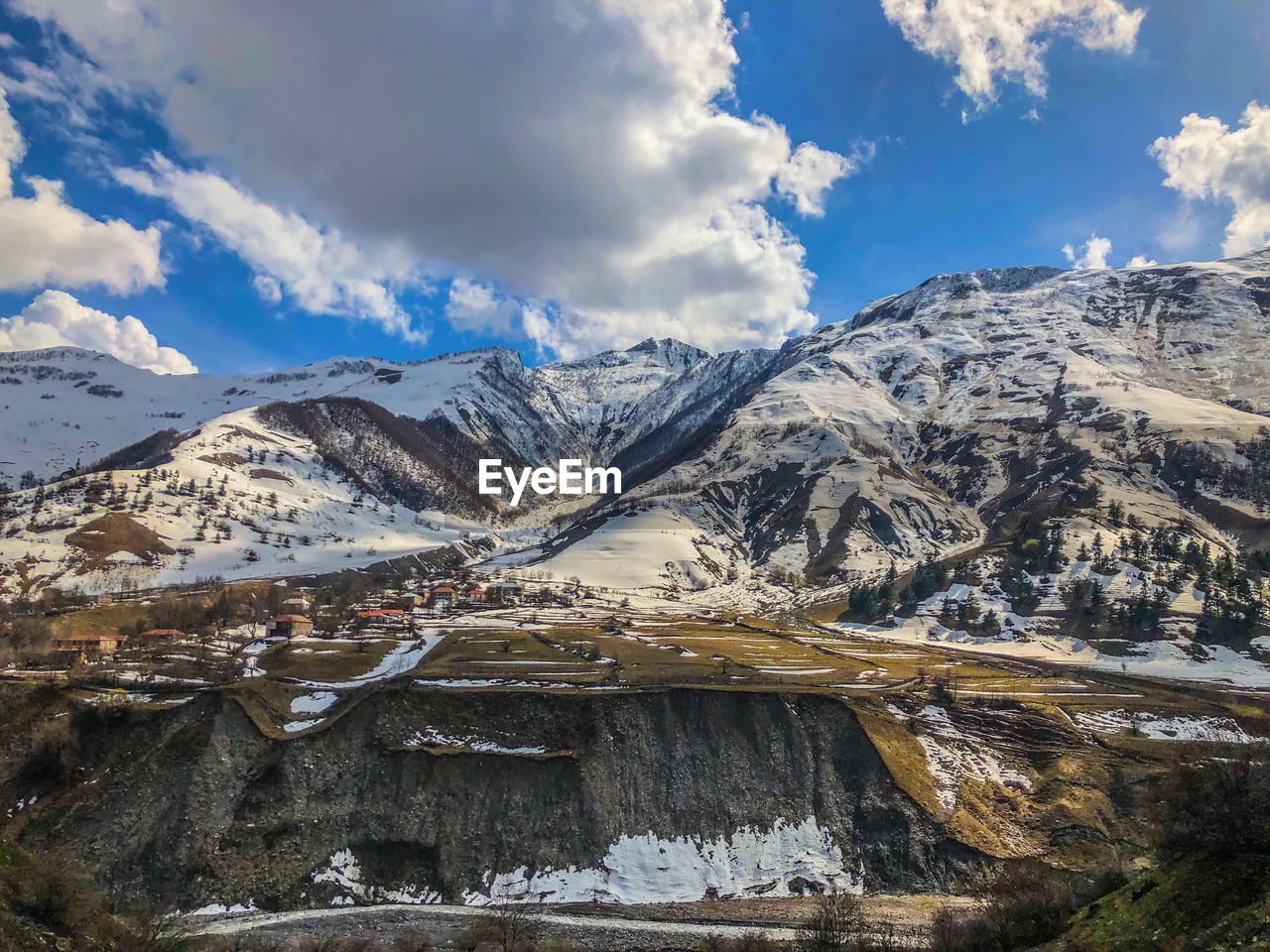 Scenic view of snowcapped mountains against sky