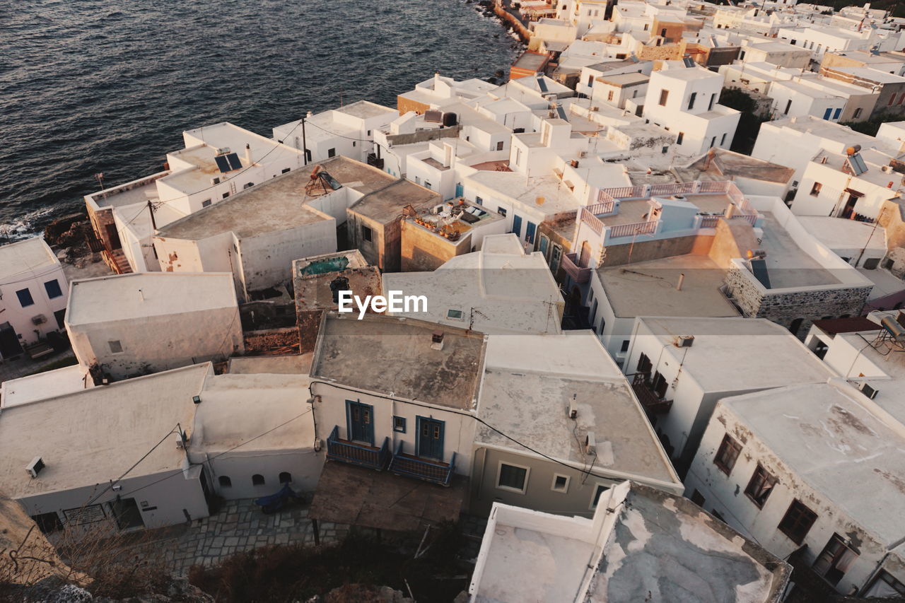 High angle view of buildings by sea