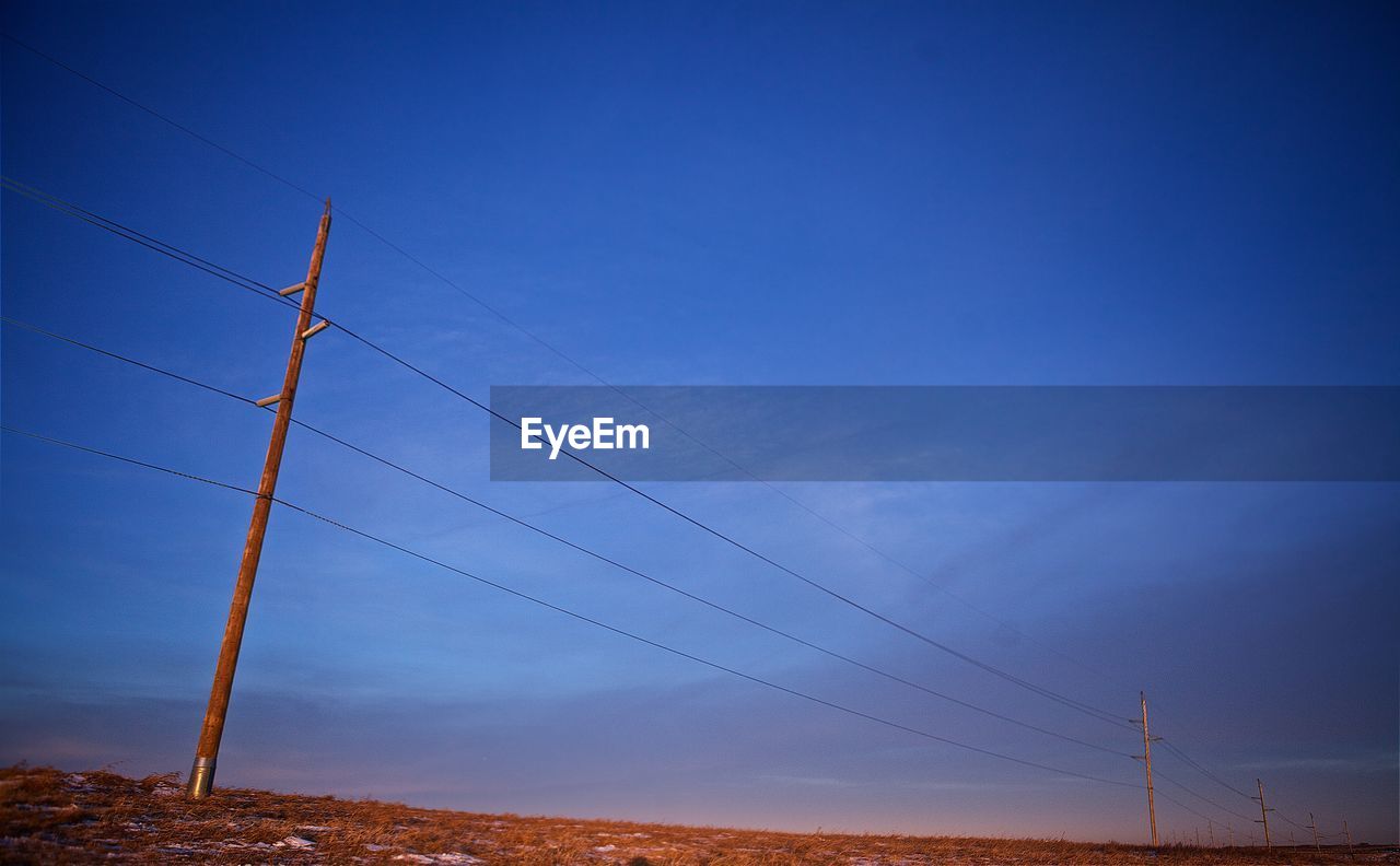 Scenic view of landscape against blue sky