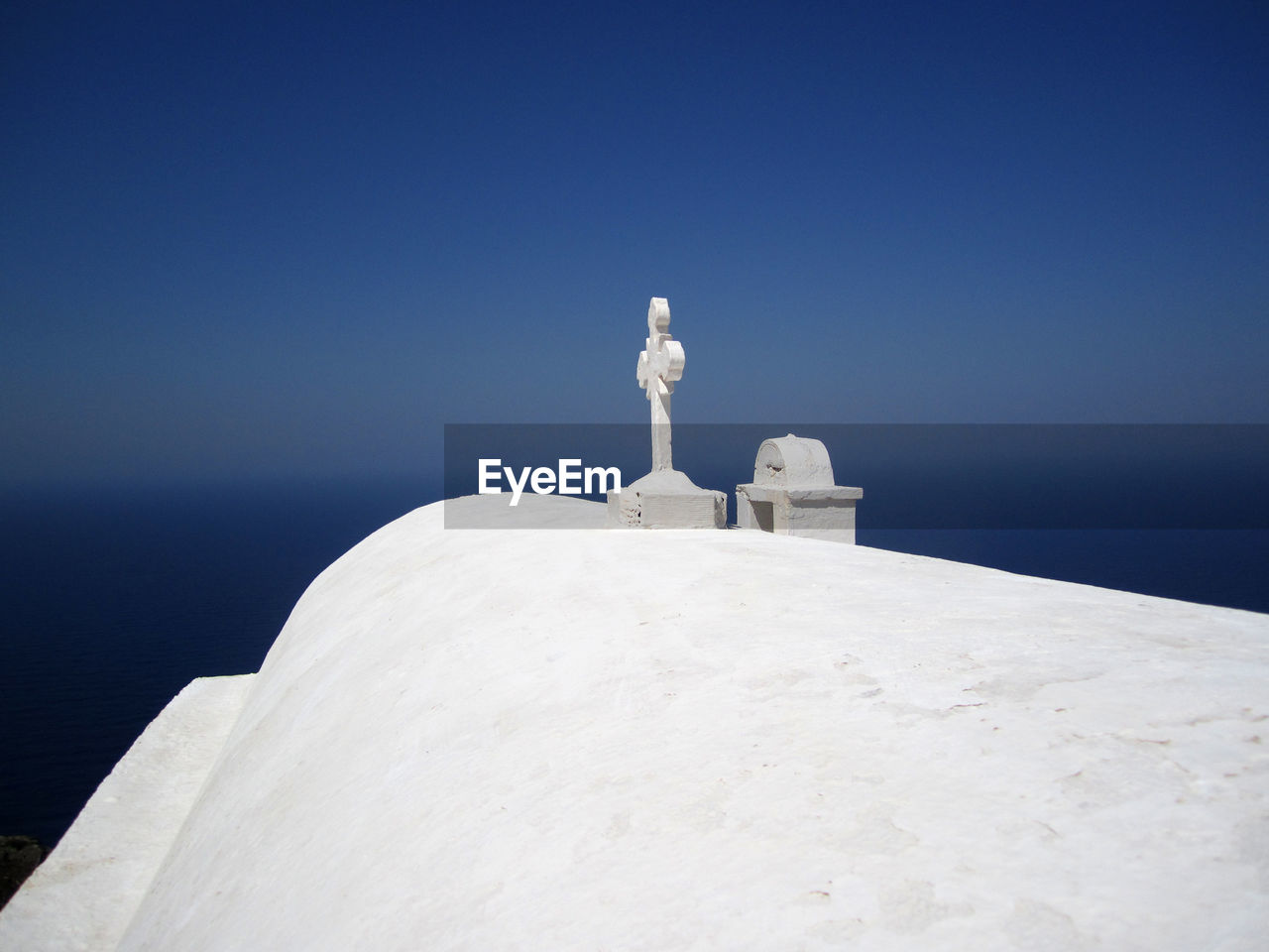 View of white cross against blue sky