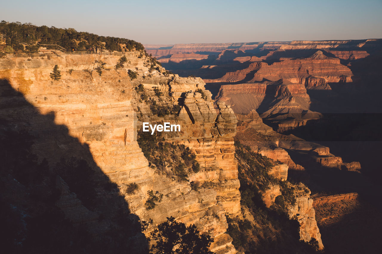 Scenic view of mountains against clear sky at grand canyon national park during sunset