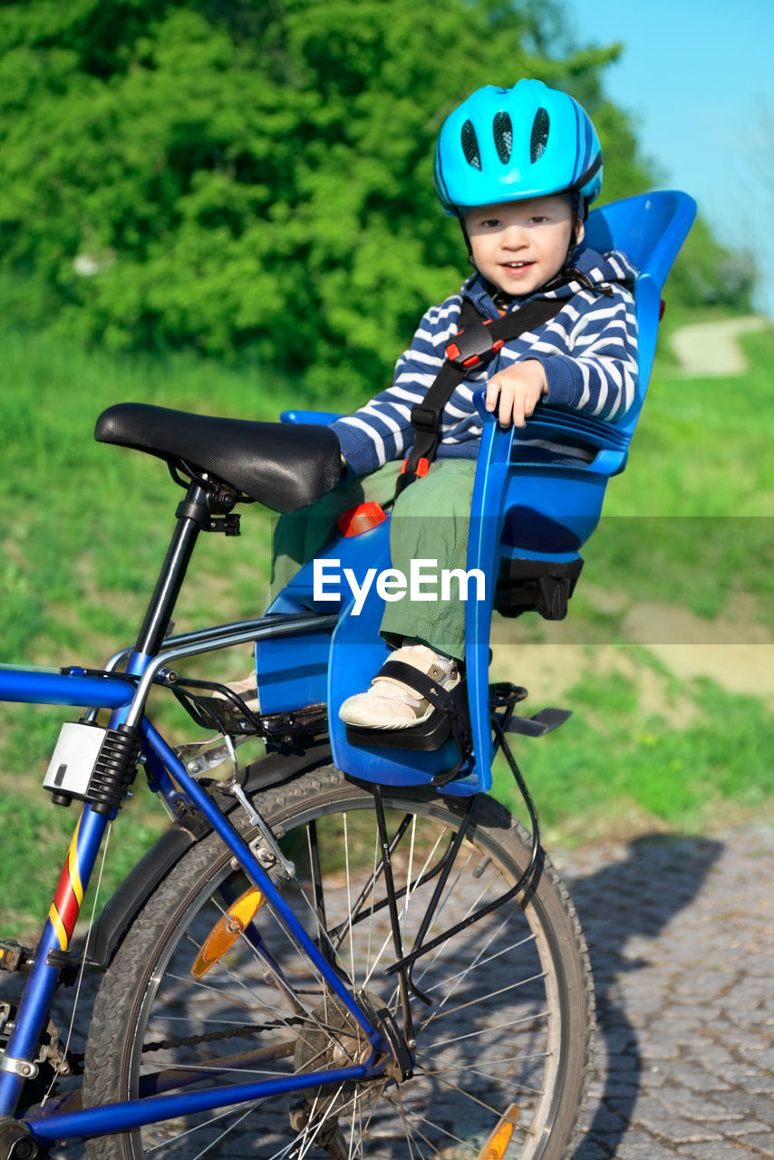 PORTRAIT OF BOY RIDING BICYCLES