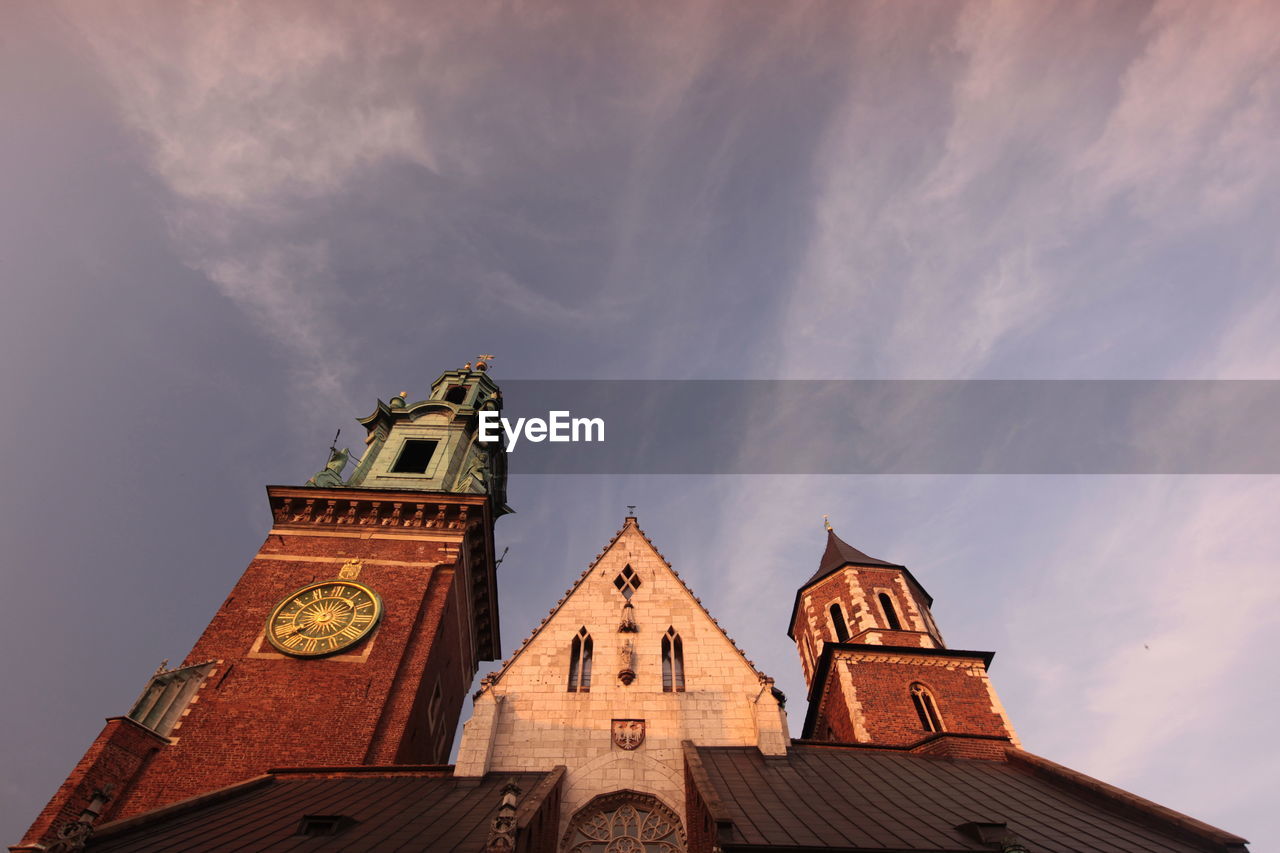 Low angle view of wawel cathedral against sky during sunset