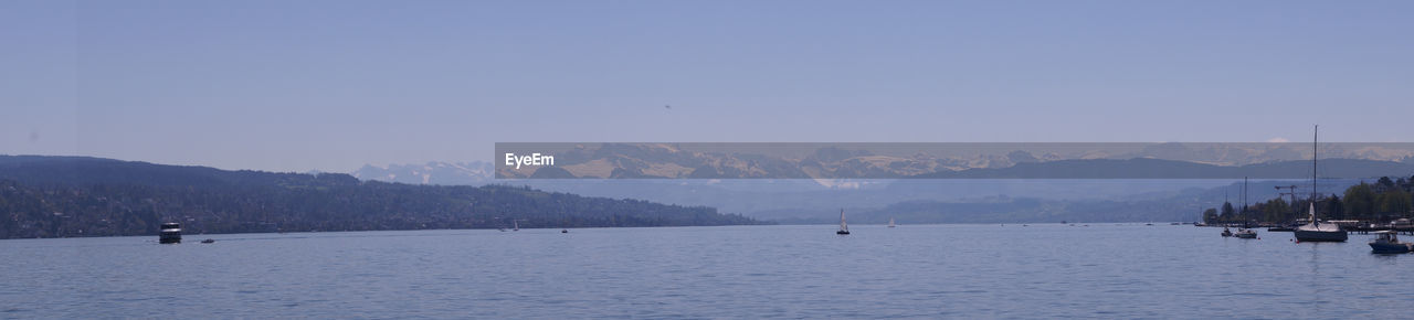 PANORAMIC SHOT OF SEA AGAINST CLEAR SKY