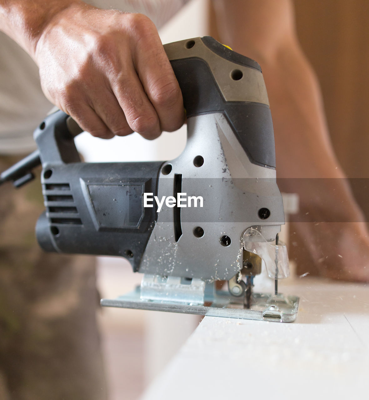 Close-up of man working on machine