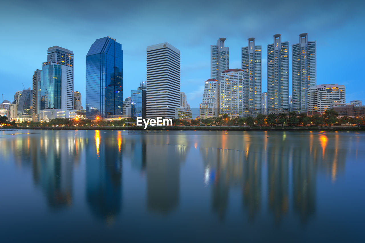 Reflection of illuminated buildings in city