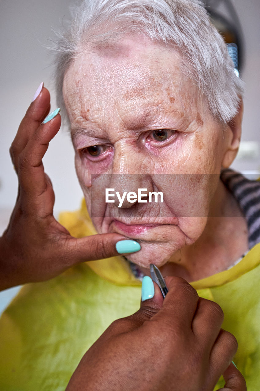 adult, senior adult, person, healthcare and medicine, human face, human head, nose, one person, human mouth, illness, portrait, medical, emotion, hand, skin, women, lifestyles, close-up, indoors, men, sadness, gray hair, facial expression, pain, medicine