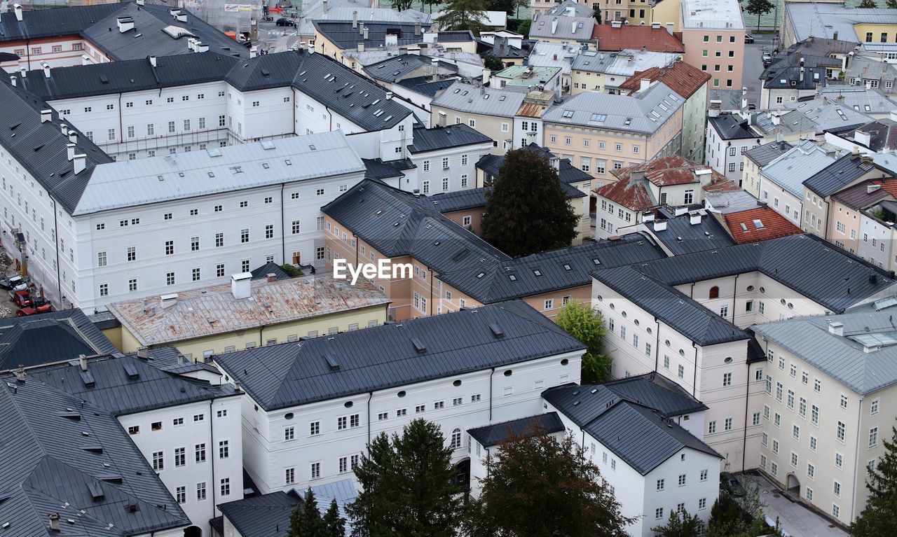 architecture, building exterior, built structure, city, high angle view, neighbourhood, building, residential area, roof, town, aerial photography, suburb, urban area, residential district, no people, tree, house, cityscape, day, nature, outdoors, plant, street, downtown