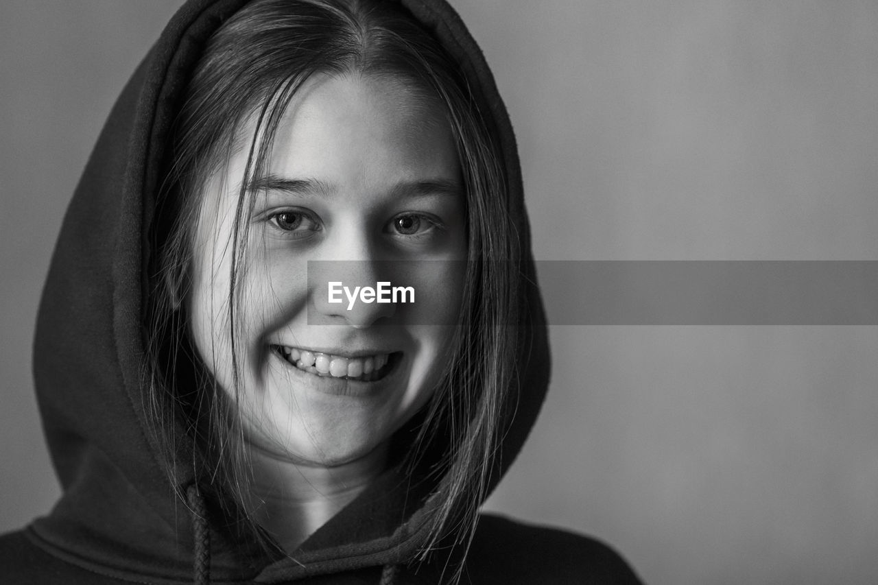 Close-up portrait of a smiling young woman