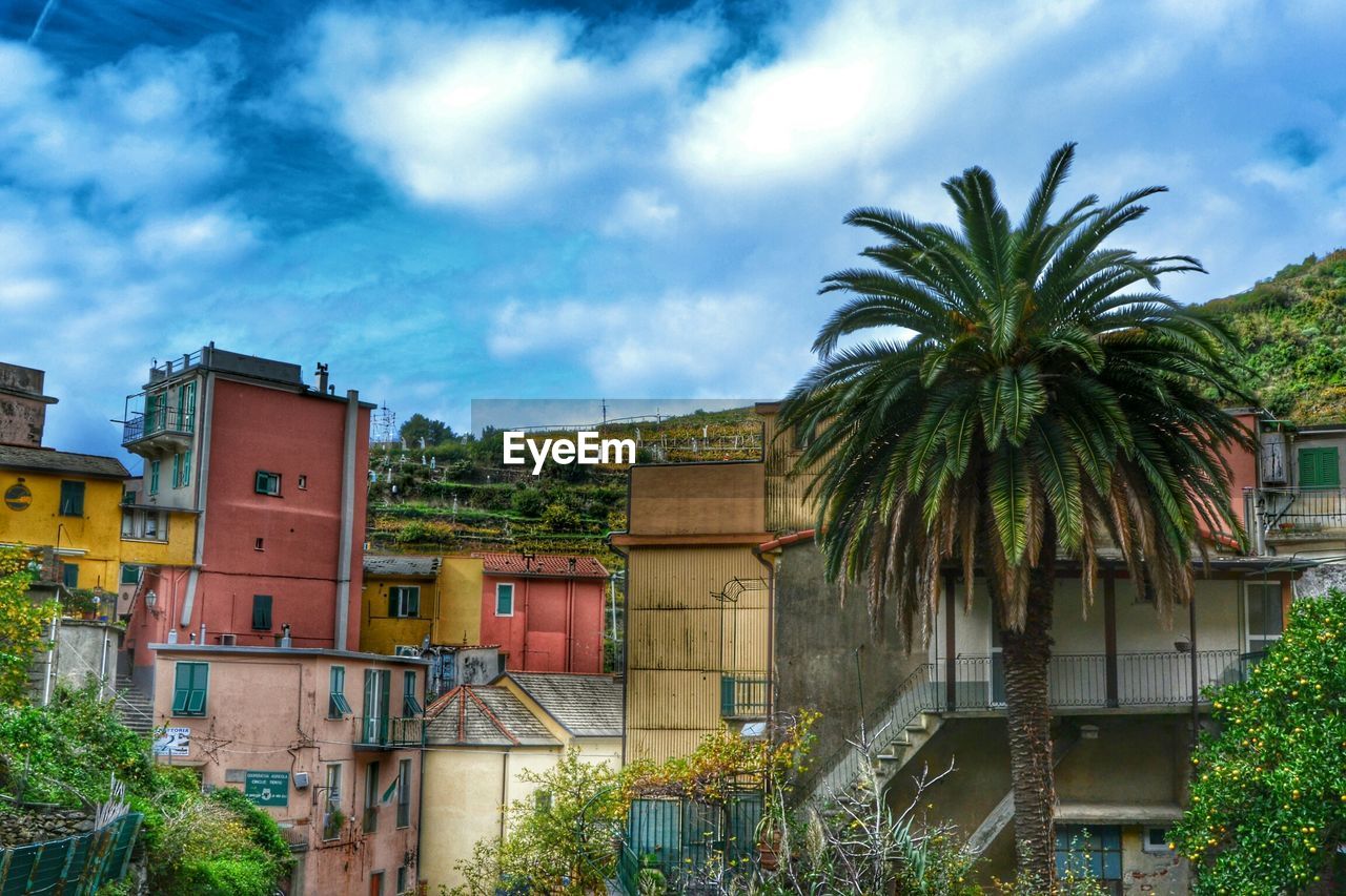 Buildings against cloudy sky