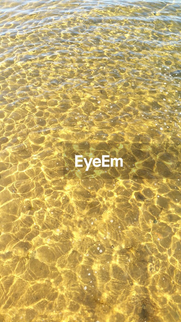 FULL FRAME SHOT OF WATER IN YELLOW