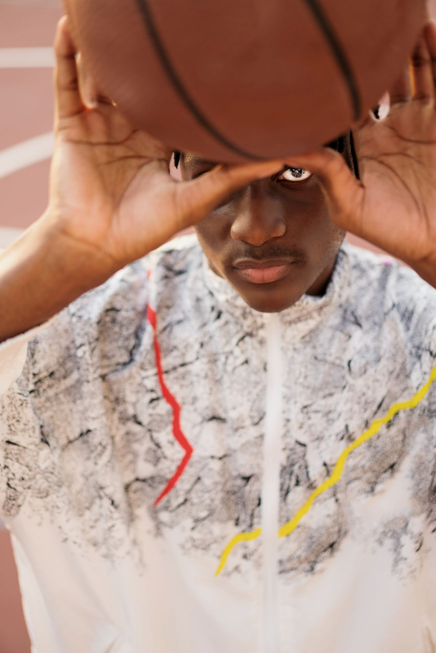 Portrait of the black man with the basketball