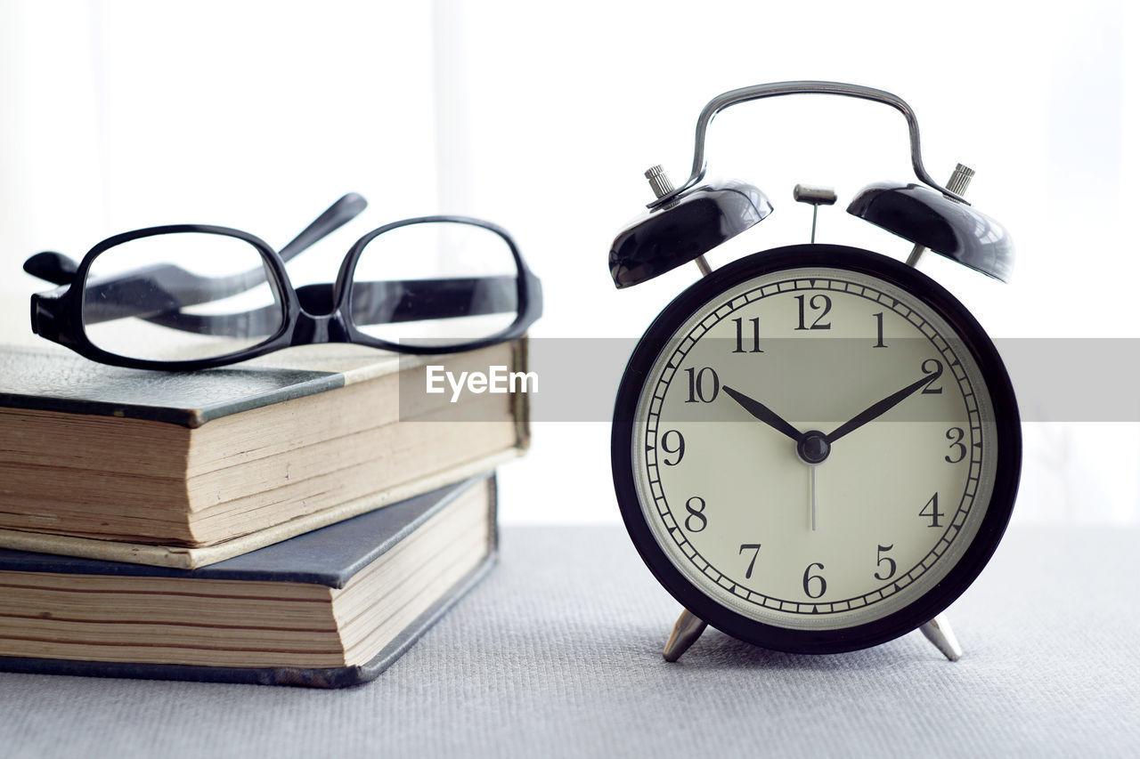 CLOSE-UP OF CLOCK ON WALL