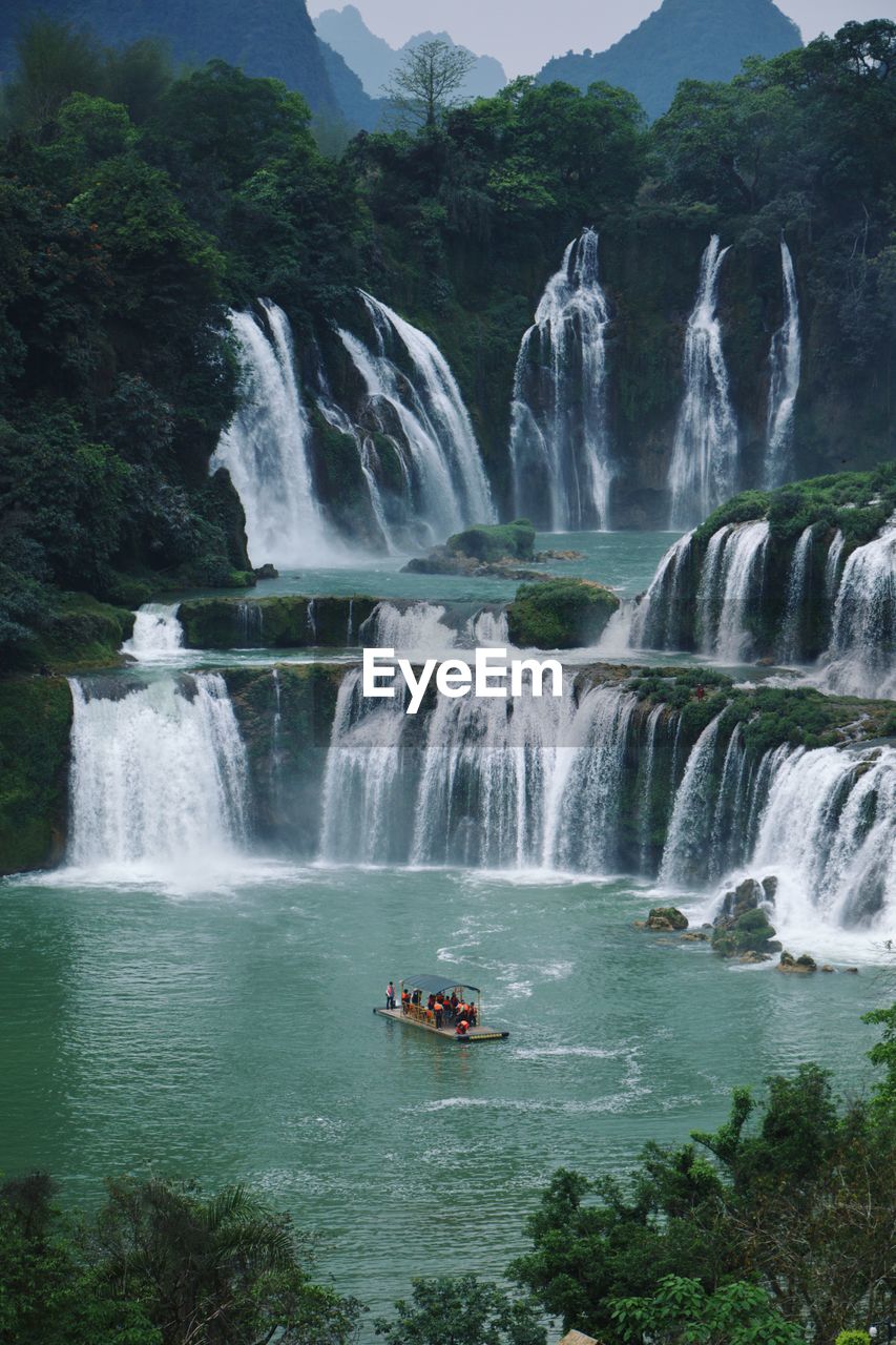 SCENIC VIEW OF WATERFALL IN THE WATER