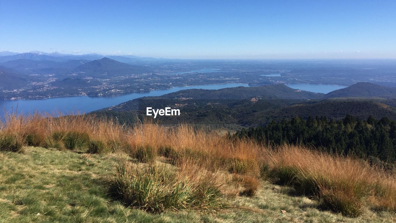 Scenic view of landscape against blue sky