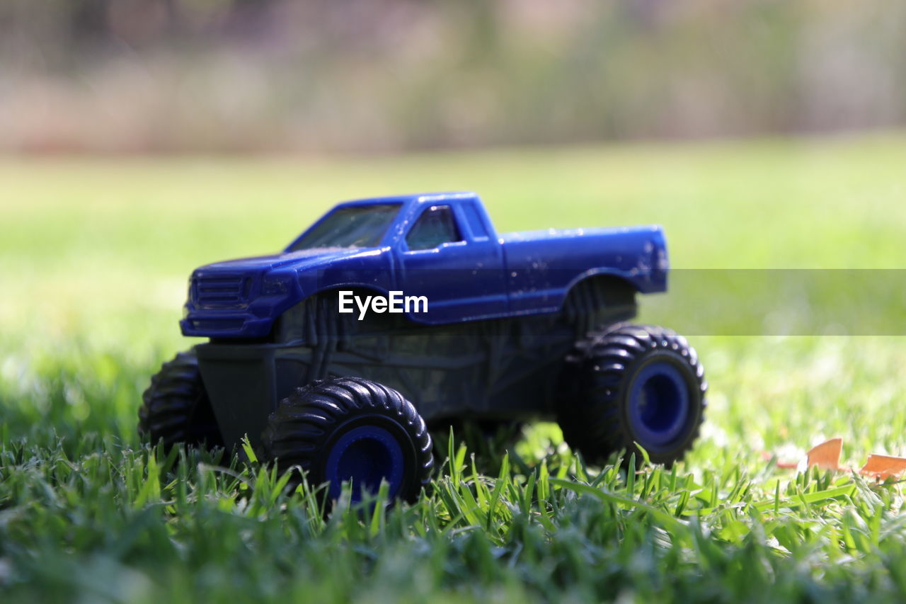Close-up of toy car on grass