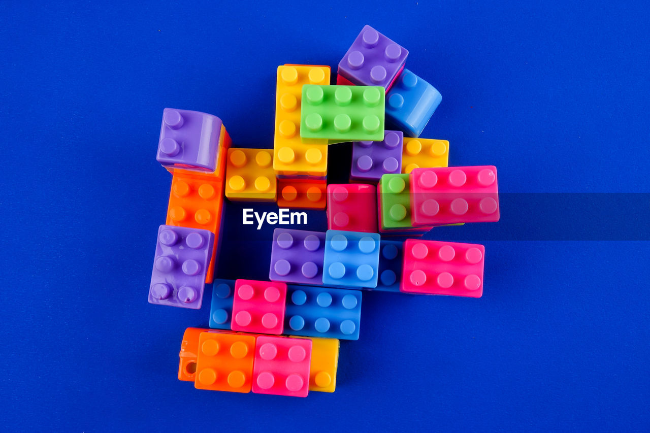 Close-up of toy blocks on blue background