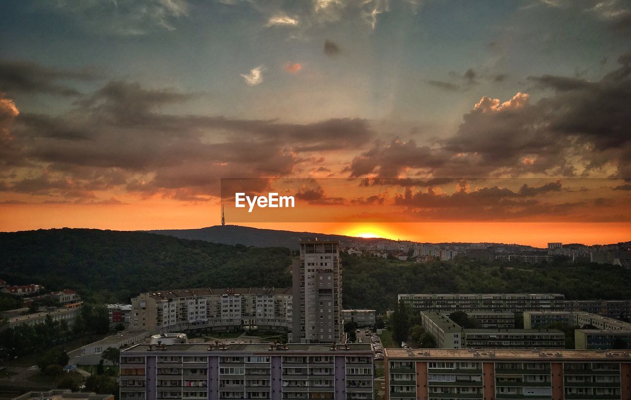 High angle view of buildings against sky during sunset