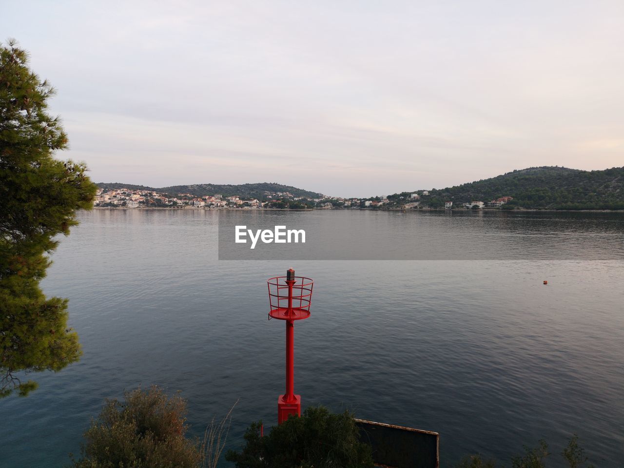 SCENIC VIEW OF LAKE BY TREES AGAINST SKY