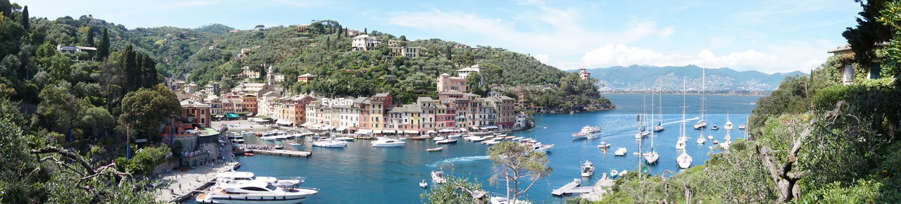 Panoramic view of boats moored in sea