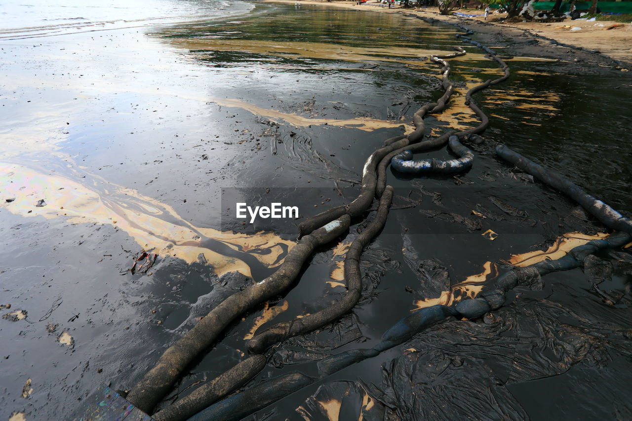 HIGH ANGLE VIEW OF WET SAND