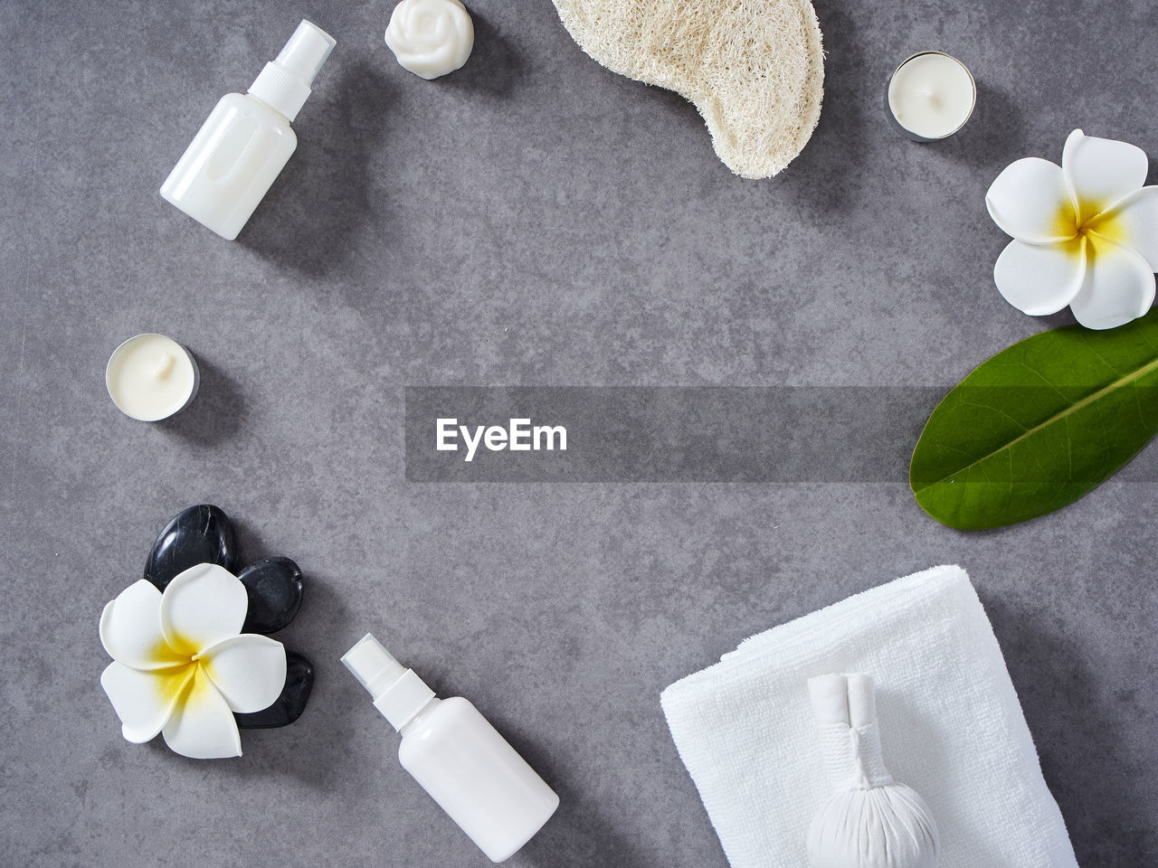 HIGH ANGLE VIEW OF WHITE AND FLOWER ON TABLE