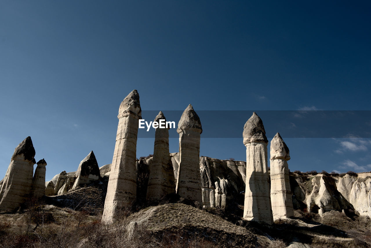 Low angle view of rock formation against sky love valley cappadocia
