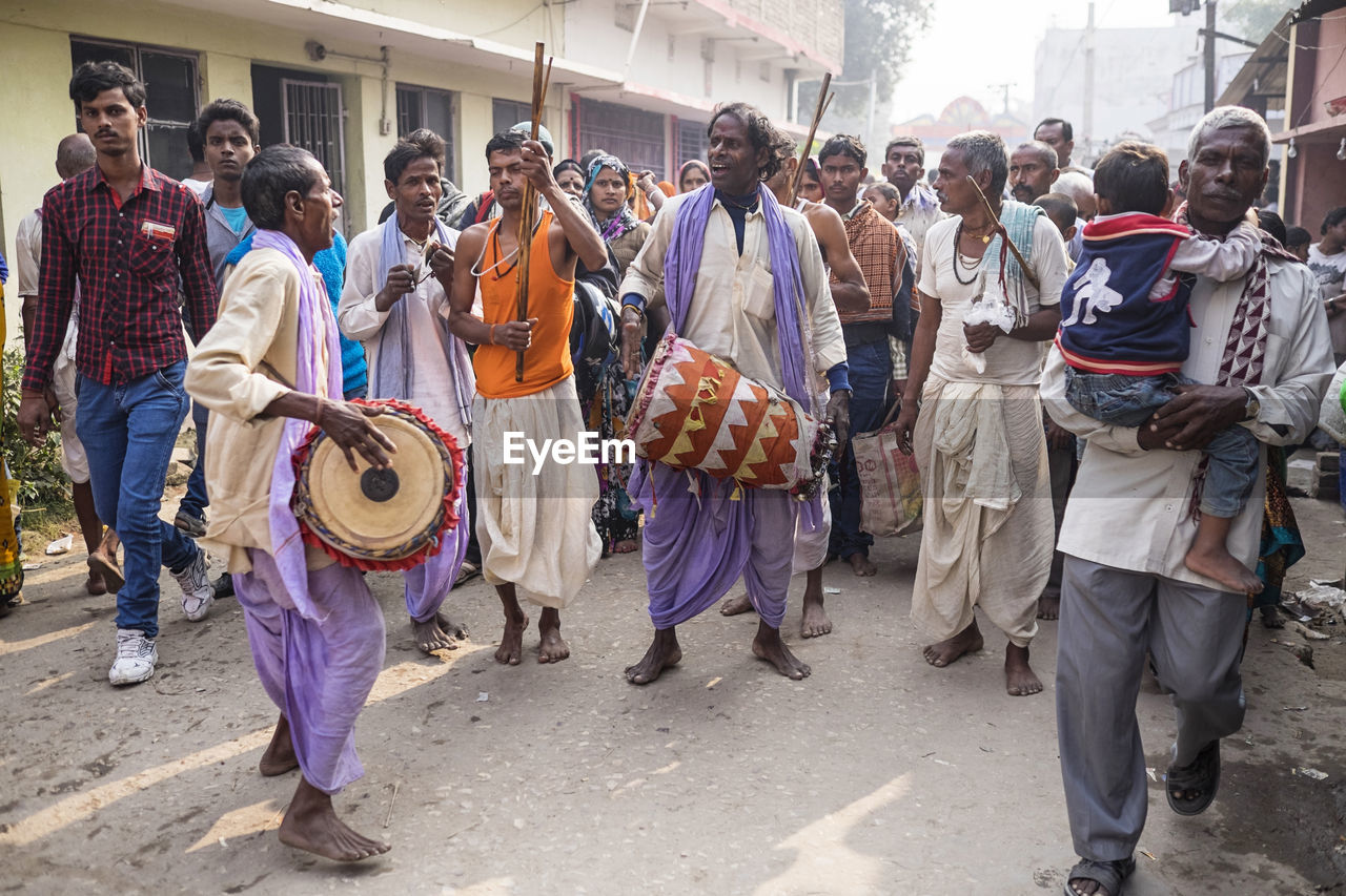 GROUP OF PEOPLE ON STREET