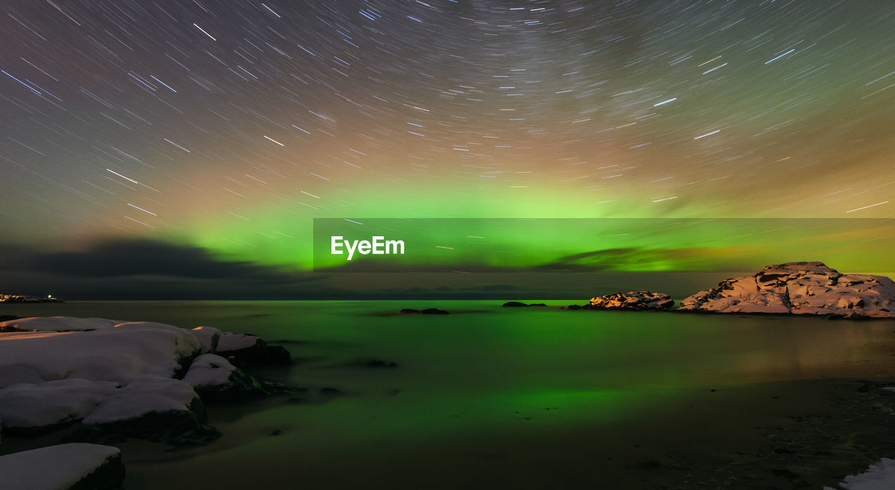 SCENIC VIEW OF LAKE AGAINST SKY AT NIGHT