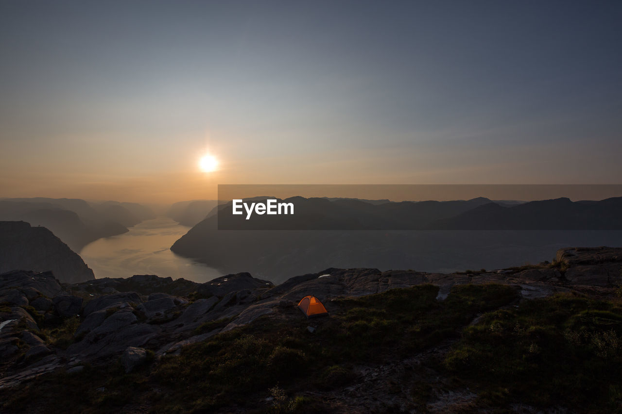 SCENIC VIEW OF MOUNTAINS DURING SUNSET