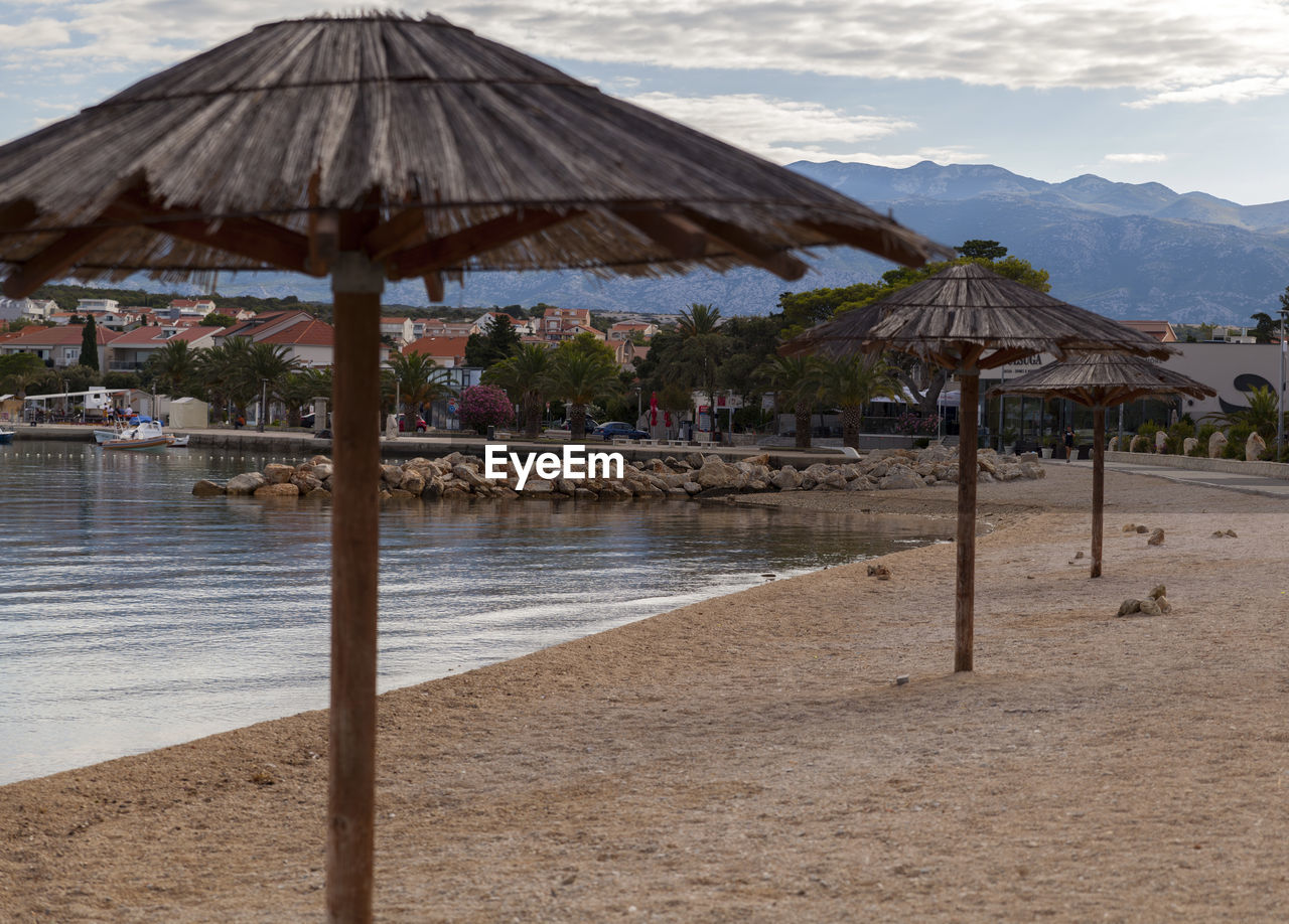 GAZEBO ON BEACH AGAINST SKY