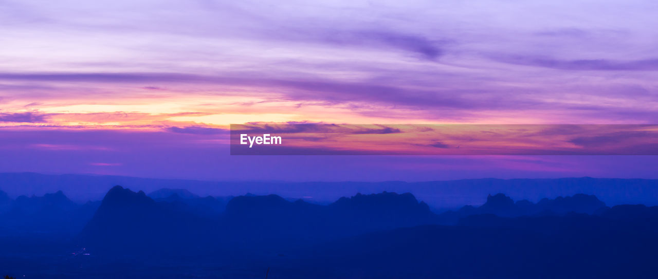 SCENIC VIEW OF DRAMATIC SKY OVER SILHOUETTE LANDSCAPE