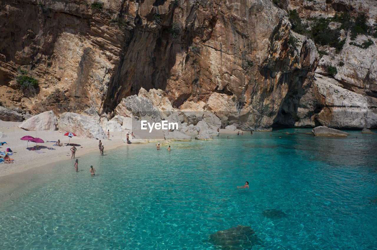 High angle view of people enjoying at beach