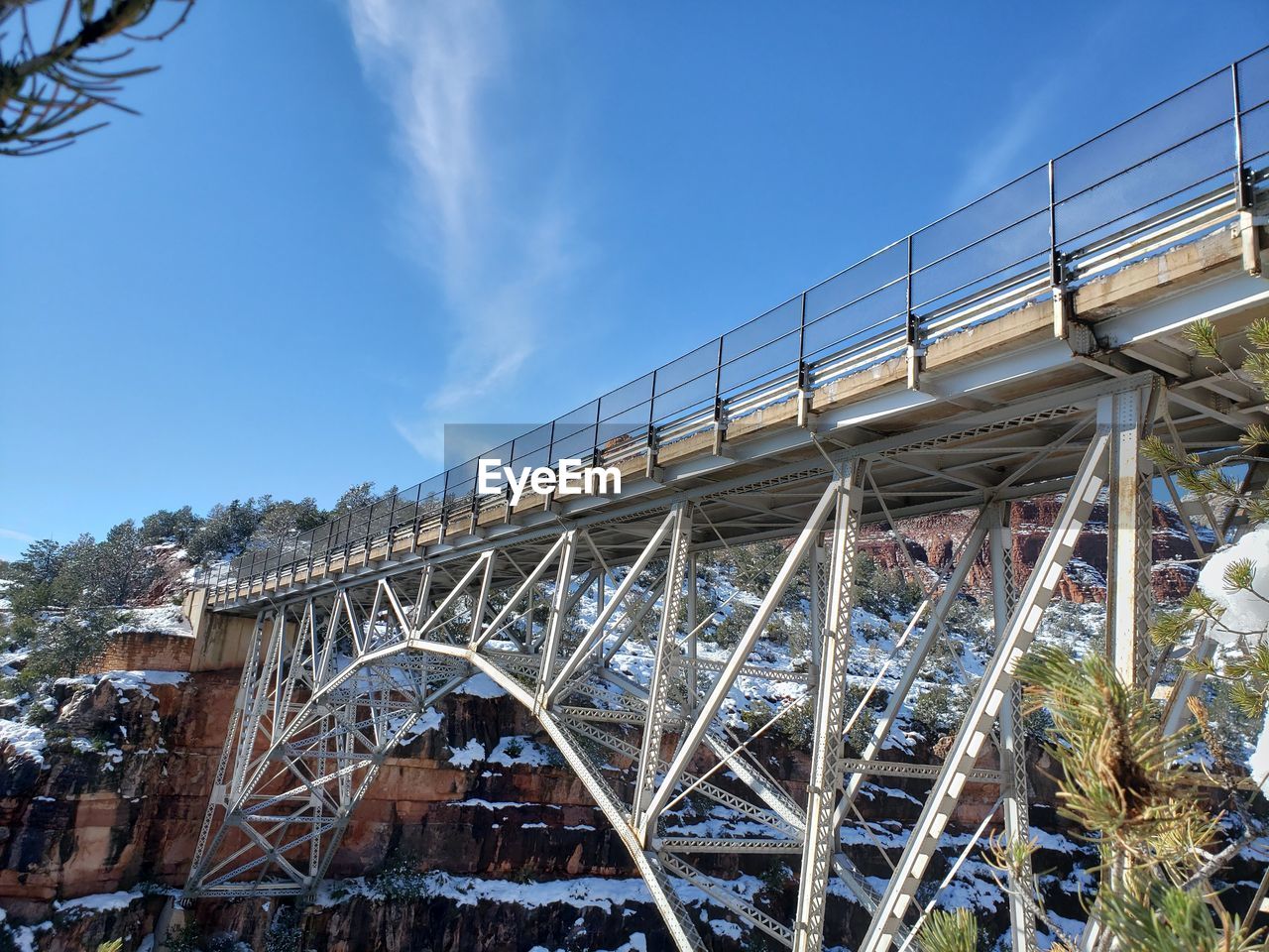 LOW ANGLE VIEW OF RAILWAY BRIDGE AGAINST SKY