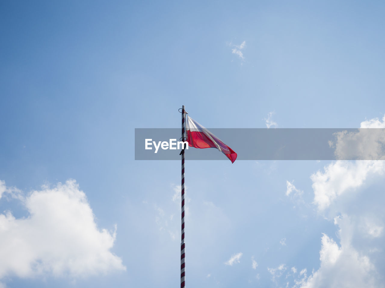 Low angle view of flag against sky