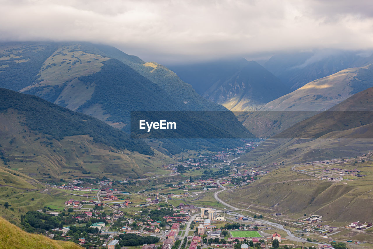 Mountain landscape with a city at the bottom of the gorge. upper fiagdon in north ossetia