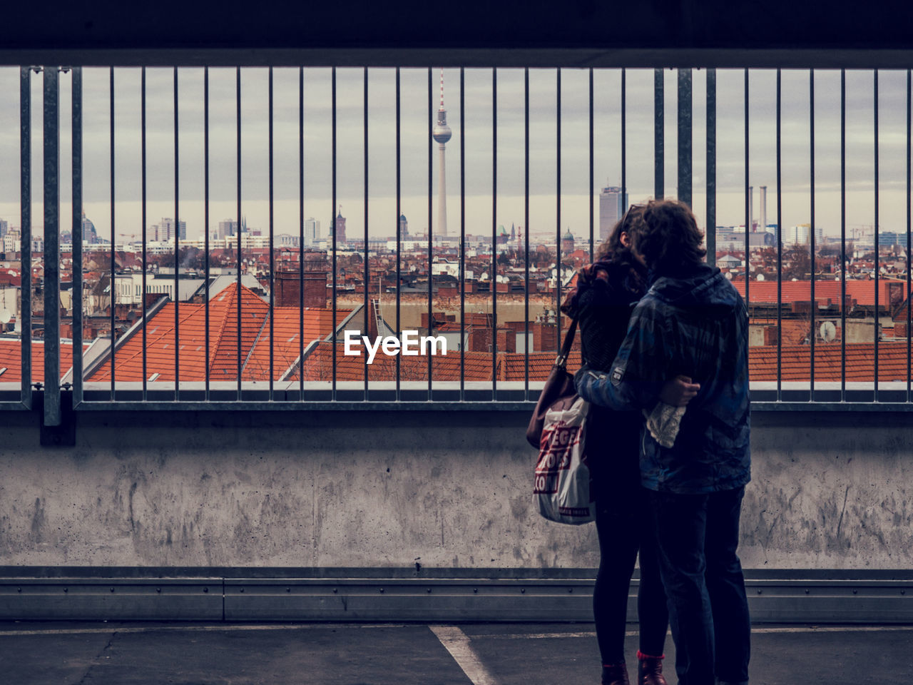 Couple kissing against cityscape