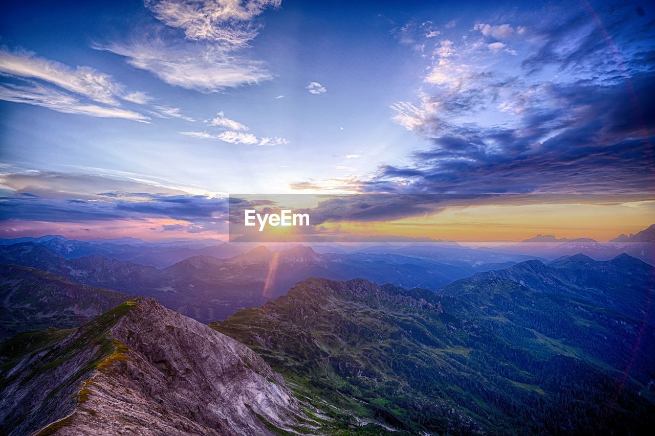 Scenic view of mountains against sky during sunset