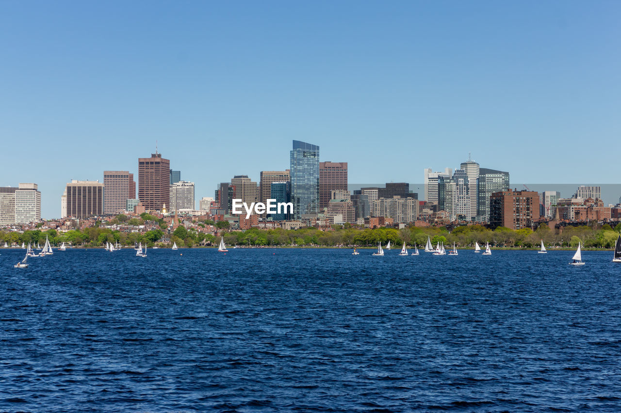 CITY BUILDINGS AGAINST CLEAR BLUE SKY