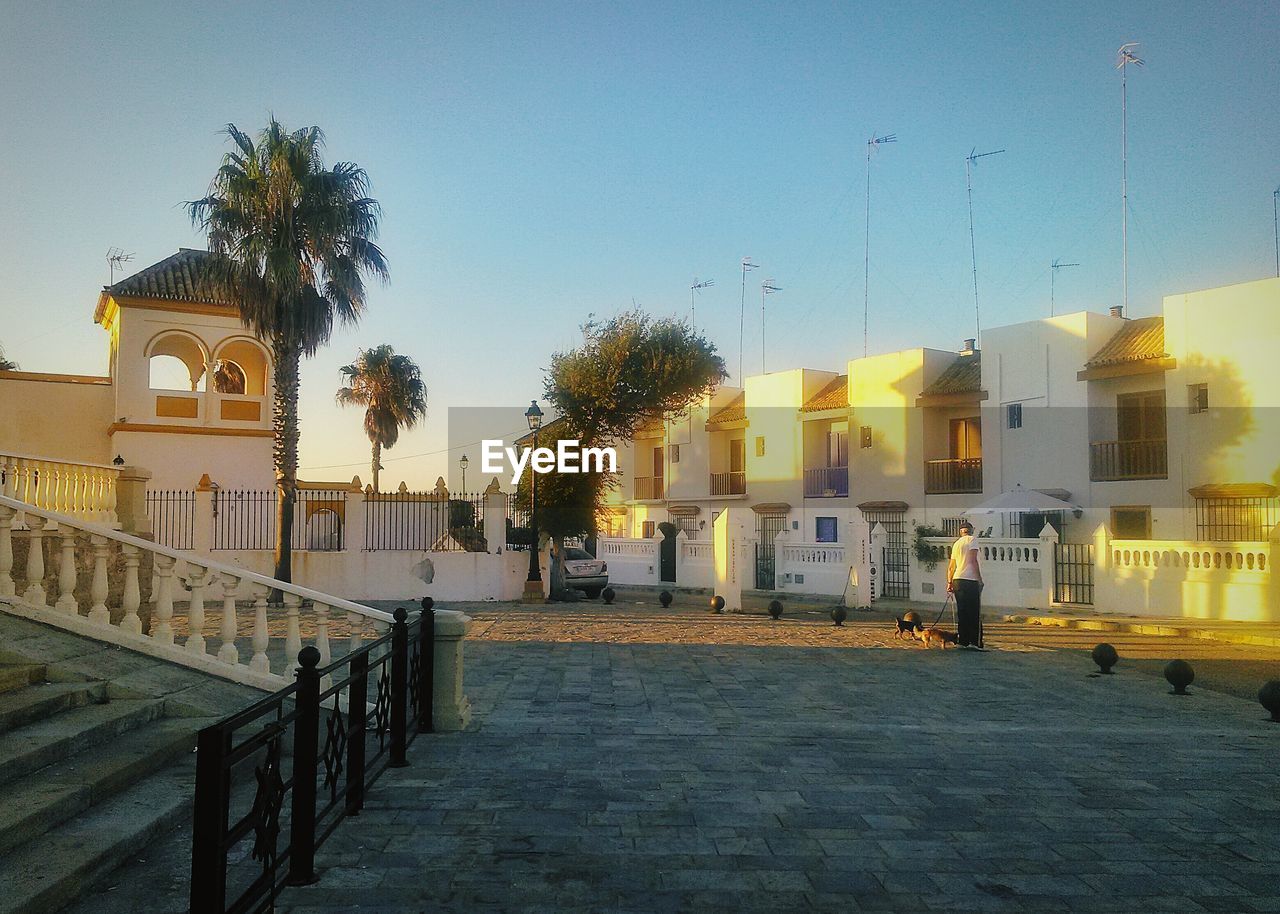 VIEW OF BUILDINGS AGAINST CLEAR BLUE SKY