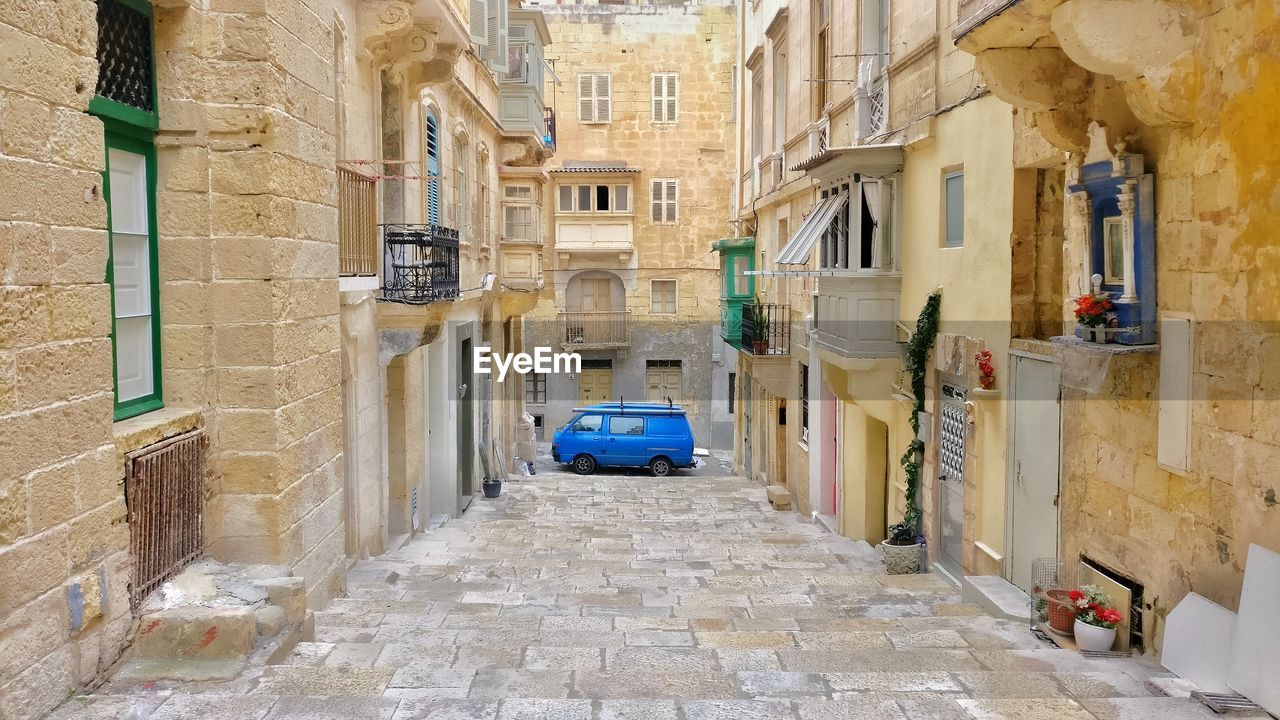 CORRIDOR ALONG BUILDINGS