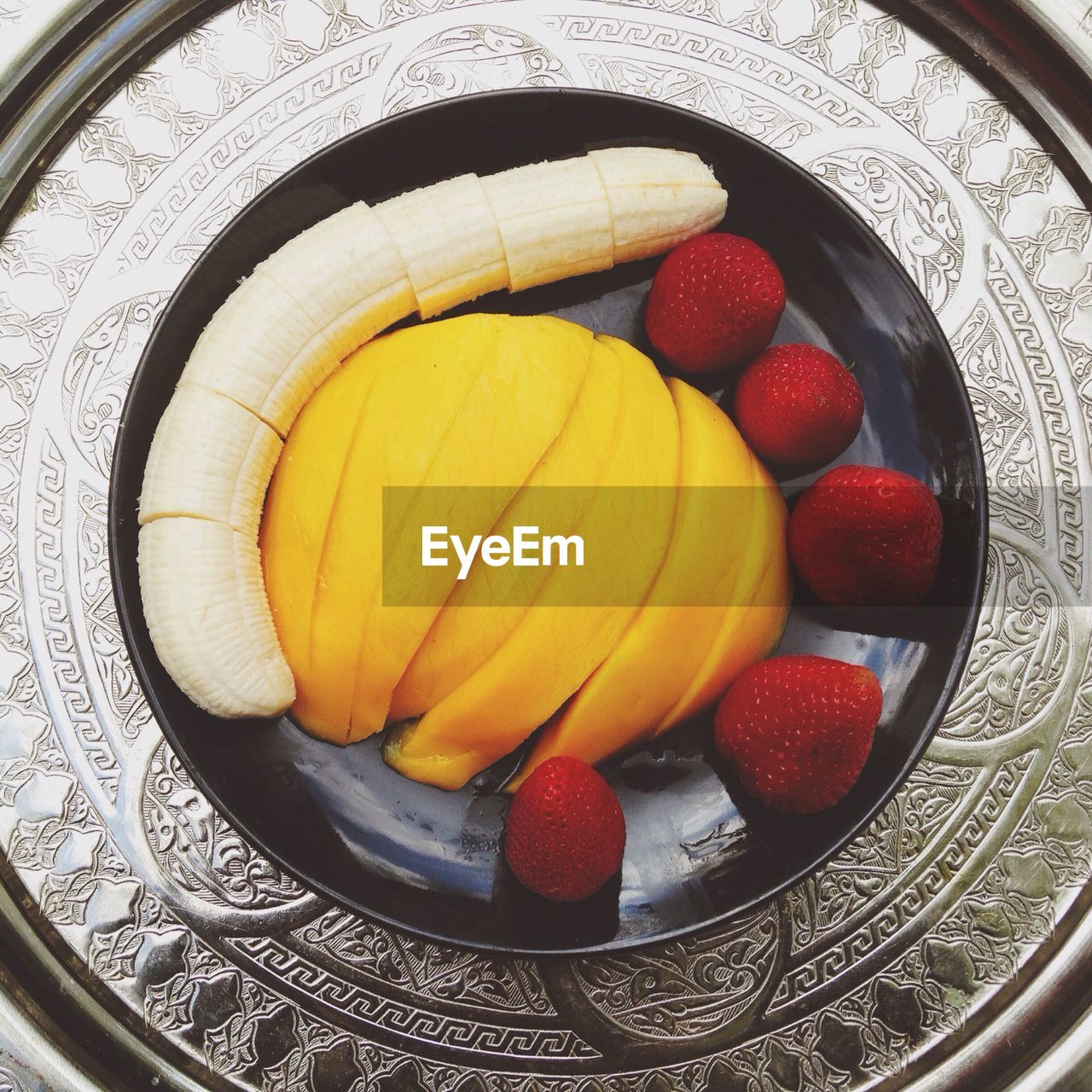 Close-up overhead view of fruits in plate