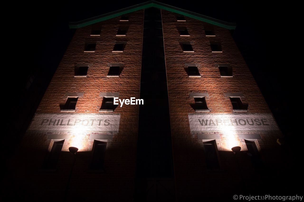 LOW ANGLE VIEW OF ILLUMINATED LIGHTS AT NIGHT